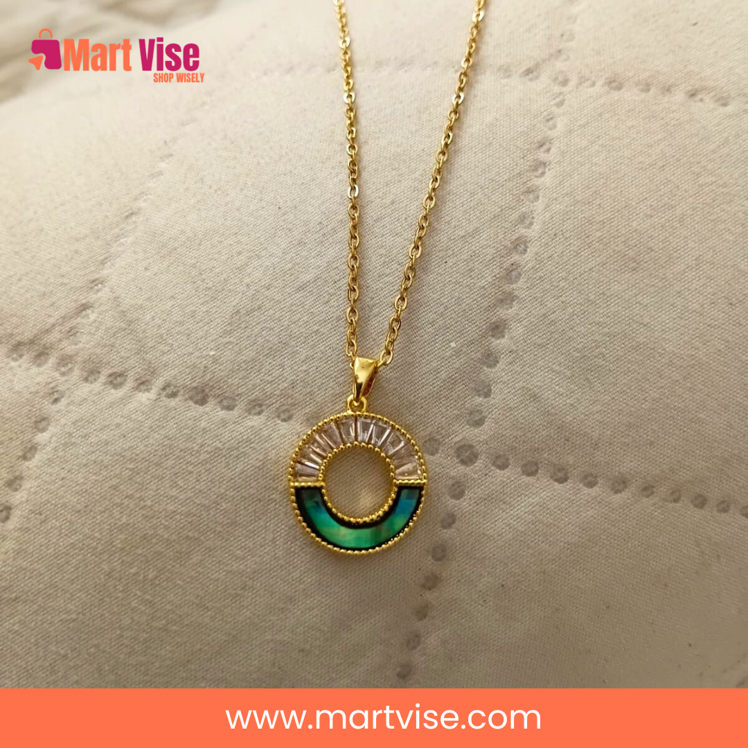 stainless-steel-golden-necklace-main.jpg – Gold-tone stainless steel round pendant necklace with crystal accents.