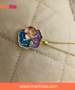 stainless-steel-enamel-necklace-closeup.jpg – Close-up of colourful enamel floral pendant with gold border.
