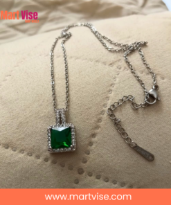 elegant-green-pendant-main.jpg – Silver-tone necklace with emerald-green square pendant and crystal border.