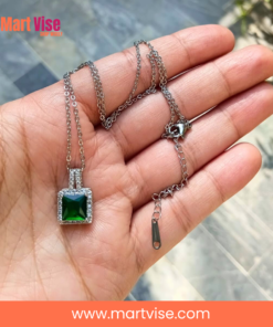 elegant-green-pendant-main.jpg – Silver-tone necklace with emerald-green square pendant and crystal border.