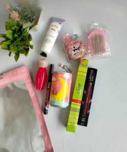 Daily Essential Kit featuring lip balm, perfume, hand cream and beauty accessories arranged together.